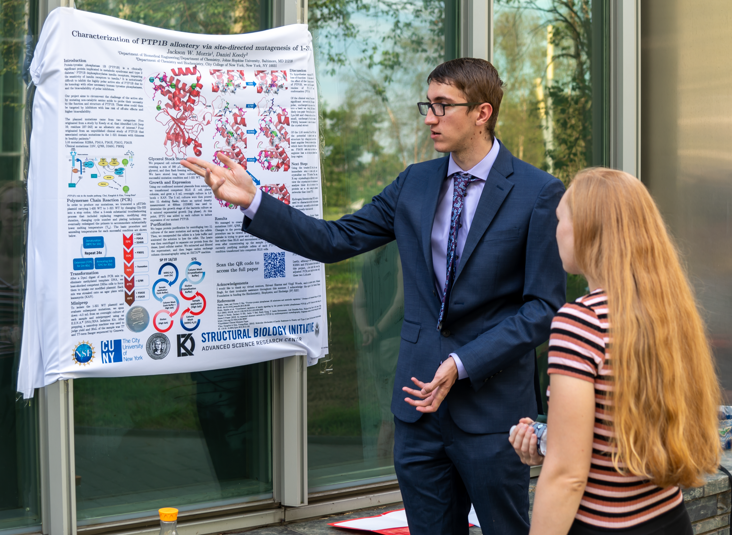 Jackson shows off his REU research poster
