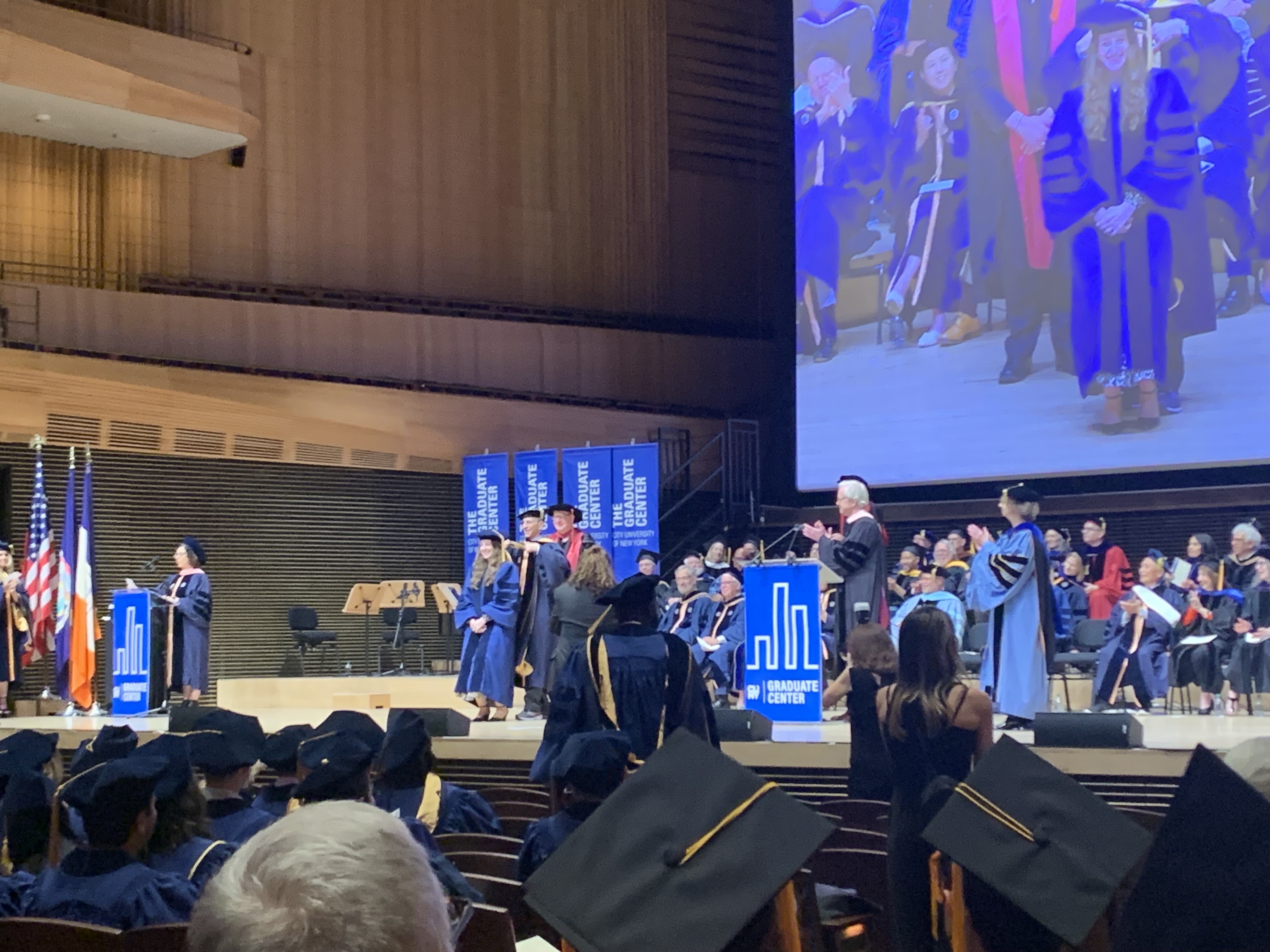 Tamar being hooded by her grandfather (!) at GC Commencement